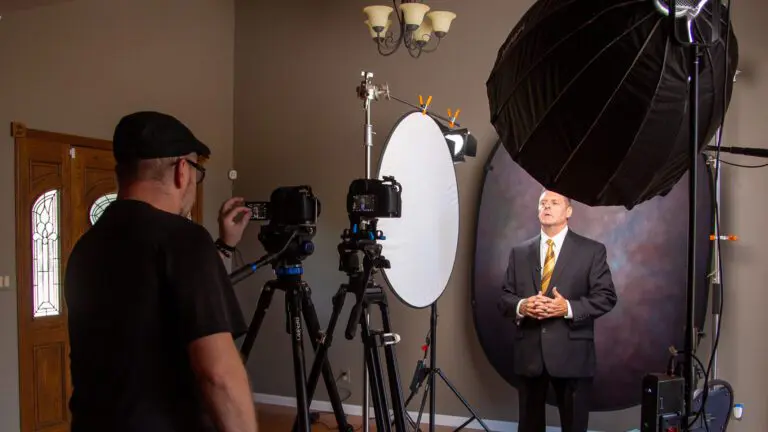 Professional behind the scenes video showing a corporate video production setup with cameras, lighting, and presenter filming.